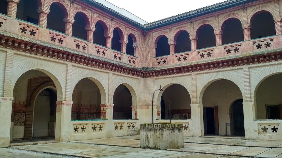 From Seville: Italica Roman City & Medieval Monastery Tour - The amphitheater and its Dragonpit connection