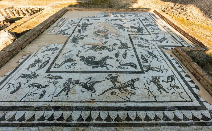 From Seville: Italica Roman City & Medieval Monastery Tour - Walking Italica’s streets and mosaics