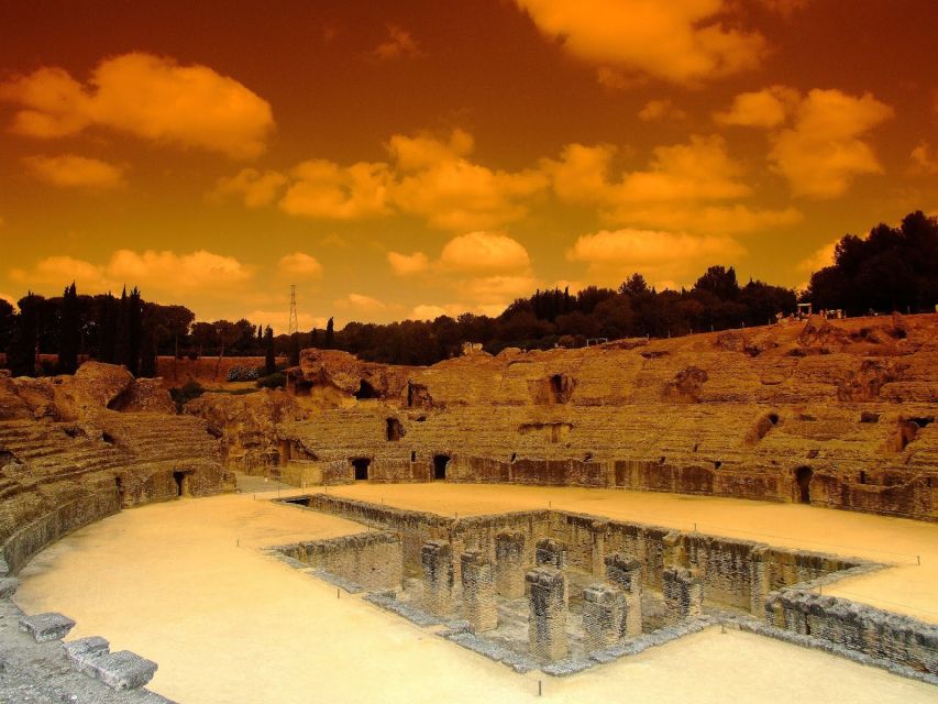 Itálica: 3-Hour City of Emperors Tour from Seville - Walking into the amphitheatre