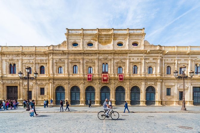 Monumental Economic tour with booking fee Seville - Crossing to Triana over Isabel II Bridge