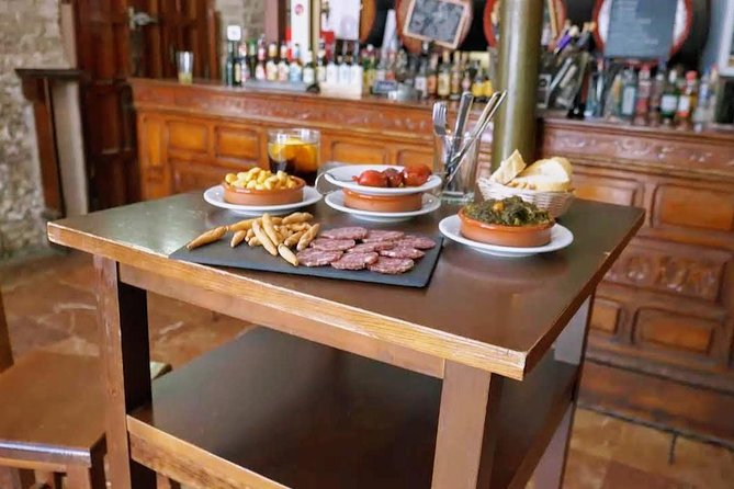 Sevilla Food Tour: Tapas, Wine, History & Traditions - Santa Cruz, family recipes, and a PX finish