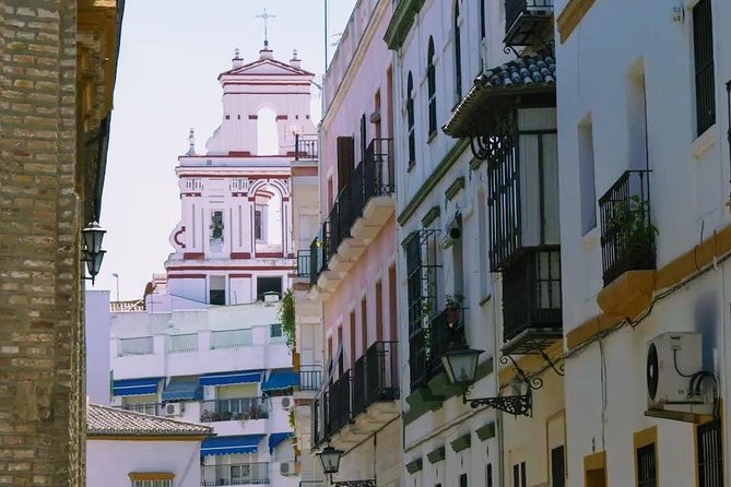 Sevilla Food Tour: Tapas, Wine, History & Traditions - Flamenco dresses at Plaza del Pan