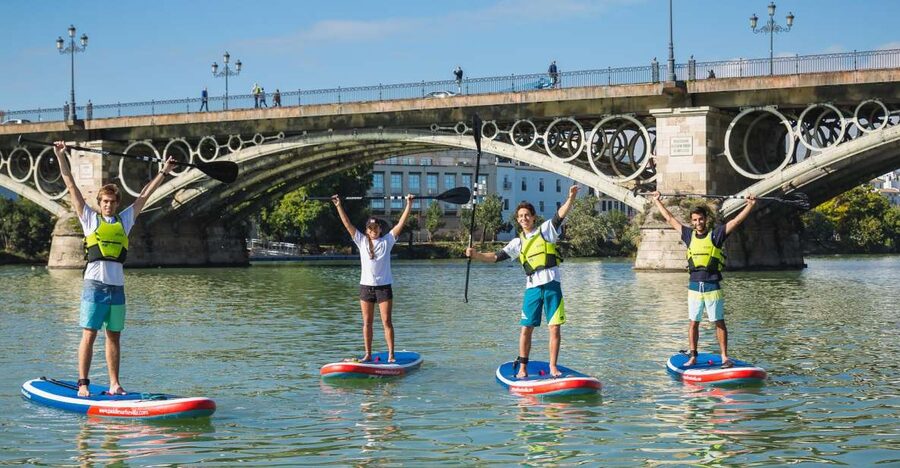 Seville: 1.5-Hour Daytime Standup Paddleboarding Tour - First strokes beneath Triana Bridge