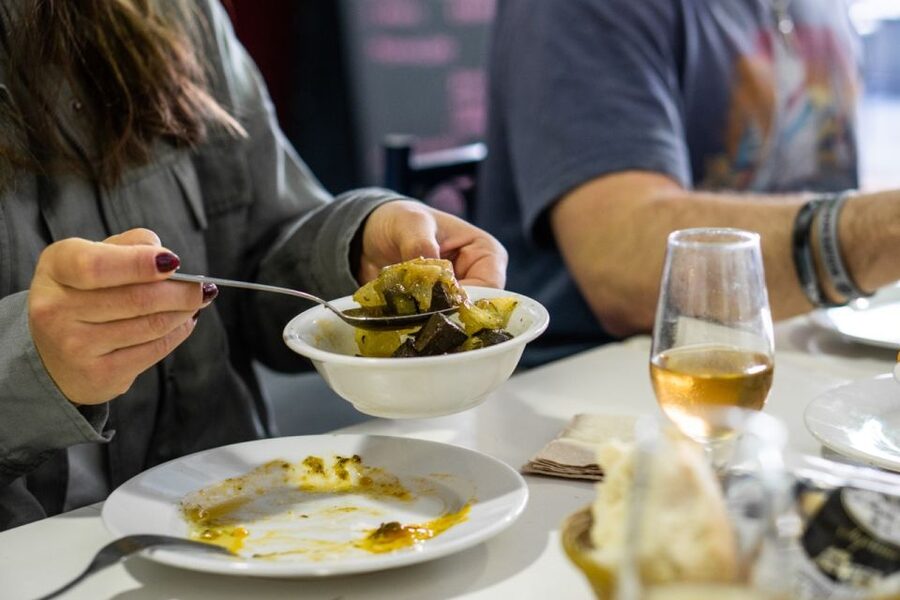 Seville: Flavors of Andalucía Guided Food Tour with Tastings - Crossing into Triana for a more local meal