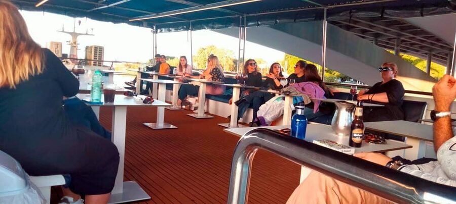Seville: Guadalquivir Boat Tour with Optional Lunch/Dinner - The boat, seating, music, and onboard service