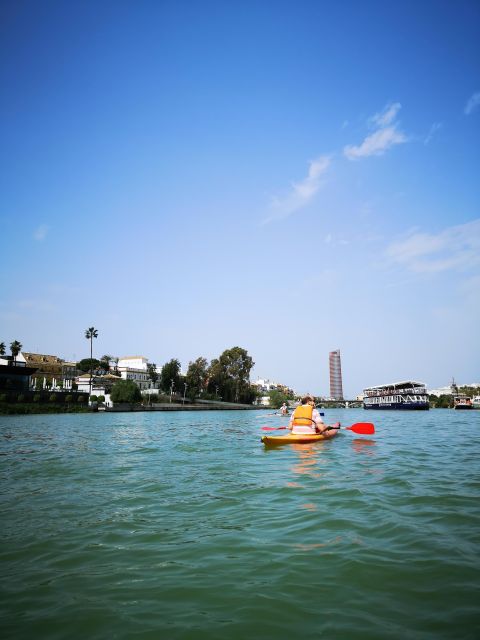Seville:Guadalquivir River Kayak Tour - Paddling past Torre Sevilla