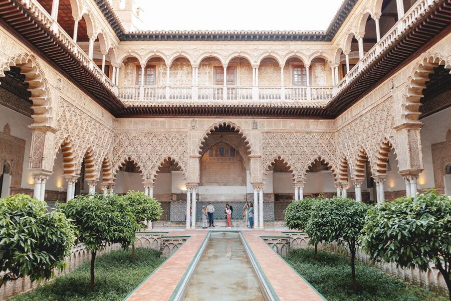 Seville: Guided Walking Tour with Alcazar & Cathedral Access - Santa Cruz, where the route slows down