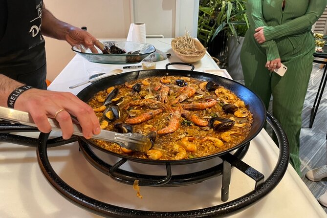 Seville: Paella Showcooking Experience - Watching paella take shape, one step at a time