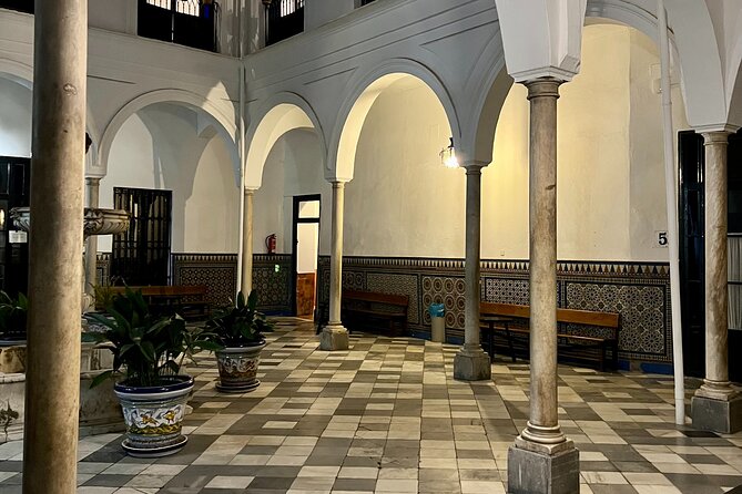 Seville Paranormal Small-Group Walking Tour - Stop four: Plaza de la Alfalfa and the Cruz de San Isidoro