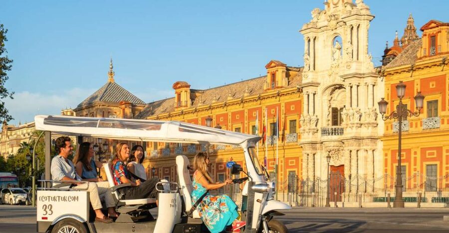 Seville: Private City Tour by Eco Tuk Tuk - Crossing Puente de Isabel II into Triana