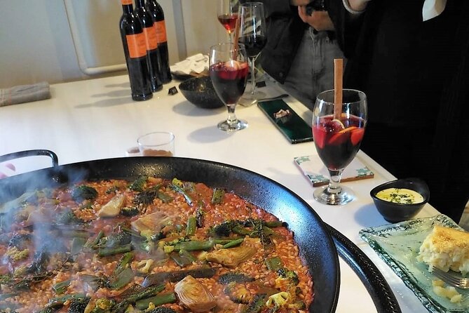Seville: Rooftop Paella Showcooking and Sangría - Watching Fabio or Antonio prepare the paella