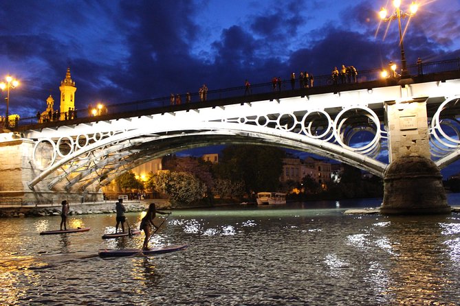 Seville: Sunset in Paddle Surf - Crossing the Puente de Isabel II into Triana