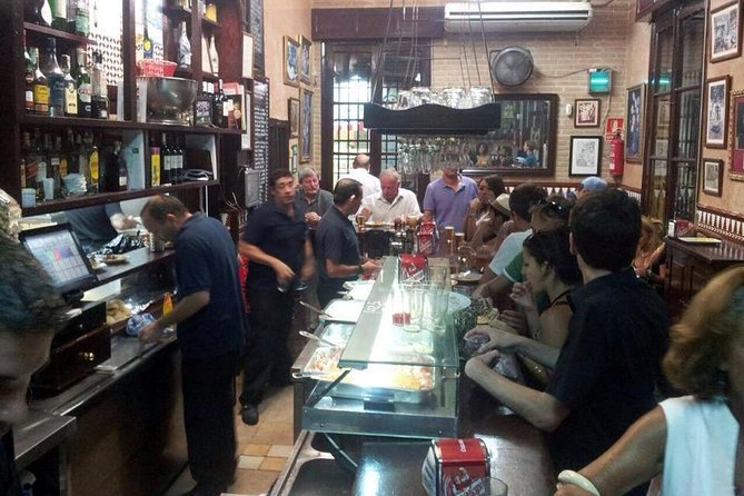 Tapas and Wine Tasting Tour in Seville Small Groups and Jewish Quarter - Seville food culture begins at the bar